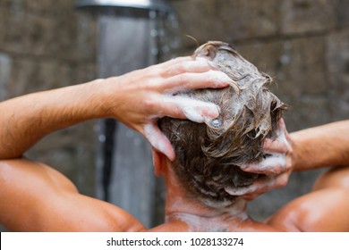 Man Washing Hair With Shampoo