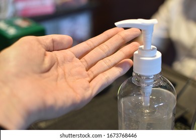 man washing hands with alcohol gel to cleaning and clear coronavirus,covid-19,germ and bacteria, Health care concept - Shutterstock ID 1673768446