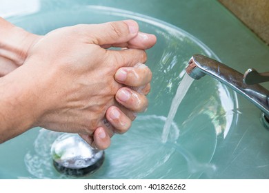 Man Washing Hands Before Eating