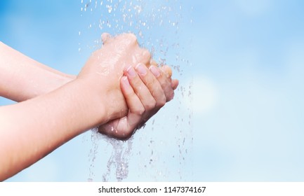 Man Washing Hands In Clean Water