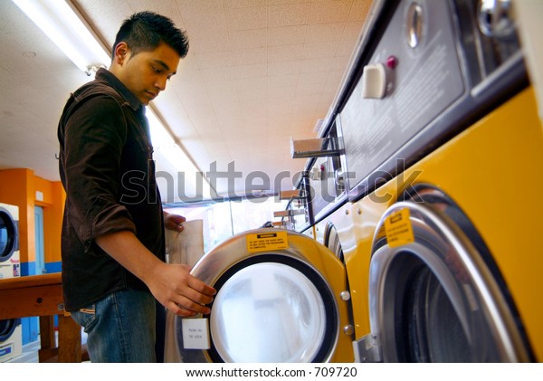 Man Washing His Clothes Local Laundromat Royalty Free Stock Image