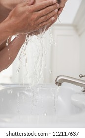 Man Washing His Face