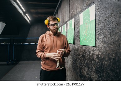 The Man Watches His Hits From A Distance. Shooting Range, Sports Entertainment. Outfit