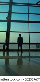 A Man Was Watching An Airplane To Take Off From Airport