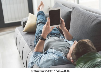 Man Watching At Electronic Tablet