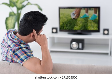 Man Watching Football Alone