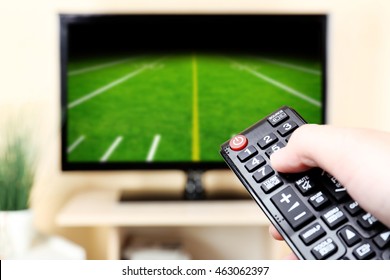 Man Watching Football Game On Tv At Home.