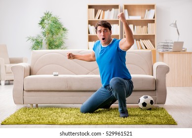 Man Watching Football At Home