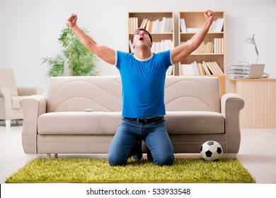 Man Watching Football At Home