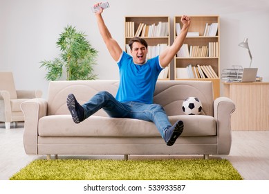 Man Watching Football At Home