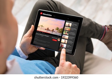 Man watching online videos on tablet