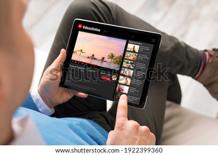 Man watching online videos on tablet