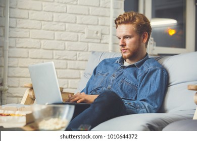 Man Watching Sport On Tv At Home Alone Making Bet