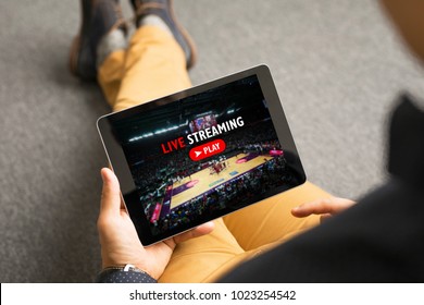 Man watching sports on live streaming online service - Shutterstock ID 1023254542