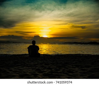 Man Watching The Sunset.