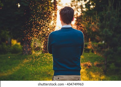 Man Watching The Sunset In A Park