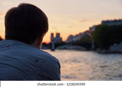 Man Watching The Sunset And River