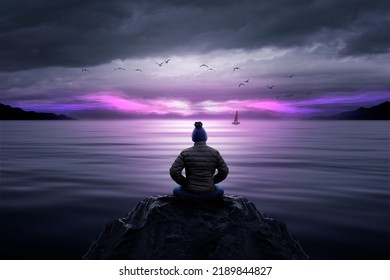 Man Watching Sunset In The Sea