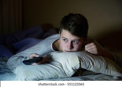 Man Watching Television In Bed At Night