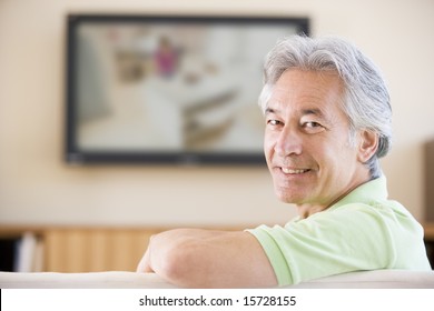 Man Watching Television Smiling