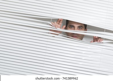 Man Watching Through Window Blinds Stock Photo 741389962 | Shutterstock