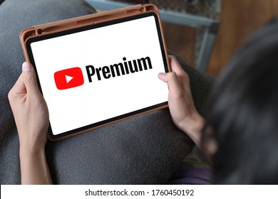 Man Watching YouTube Premium On IPad ,With YouTube Premium, Enjoy Ad-free Access, Downloads, And Background Play On YouTube And YouTube Music By Google : LOEI ,THAILAND,20 June 2020