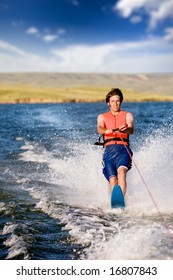 A Man Water Skiing On A Lake
