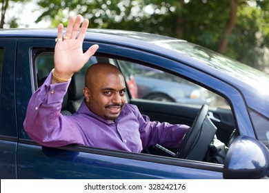 Man Waving Goodbye From His Car