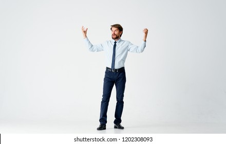 Man Waving His Arms On Light Background                     