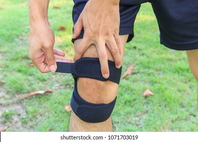 The Man Wear Knee Support With Sunlight In The Park / Brace Knee Pads Leg 