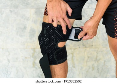 The man wear Knee Support with sunlight in the park - Brace Knee Pads Leg 