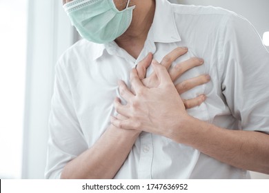 Man Wear Medical Face Mask, Symptoms Of Coronavirus Diseases, Chest Pain - Heart Attack, Fever, Cough, Shortness Of Breath During Work In Office, Health Care Concept.