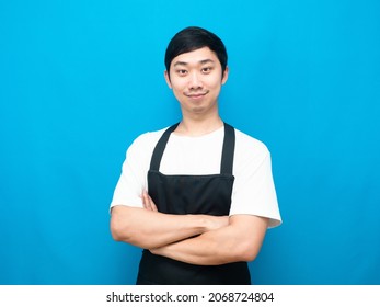 Man Wearing Black Apron Cross Arm Look Confident Blue Background