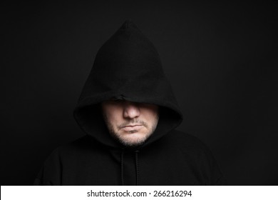 scary man in black hoodie