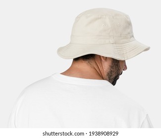 Man Wearing Bleached Bucket Hat, Rear View