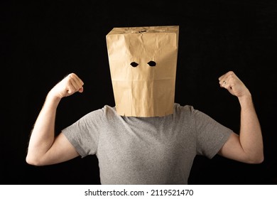 Man Wearing A Brown Paper Bag Over His Head And Flexing His Arms