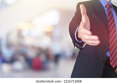 Man Wearing A Business Suit Reaching Hand