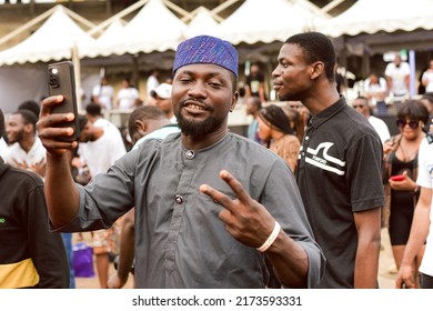 A Man Wearing A Cap Poses For A Photo At Tafawa Balewa Square In Lagos, NIGERIA, On June 11, 2022.