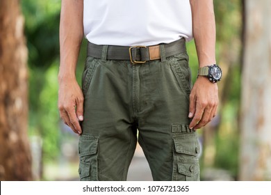 Man Wearing Cargo Pants Standing In The Nature Park