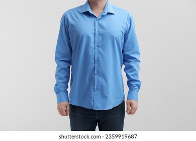 Man wearing clean shirt on white background, closeup. Space for text - Powered by Shutterstock