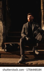 Man Wearing A Coat, Black Gloves, And Black Golf. Fashion Portrait Of Caucasian Man, Successful Businessman