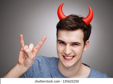 Man Wearing Devil Horns