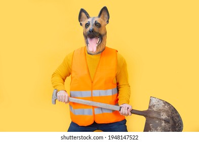 Man Wearing Funny Mask With Shovel Working