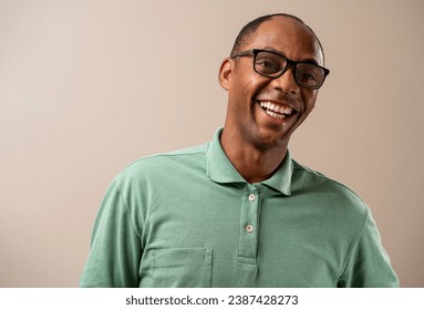 Man wearing glasses smiling on pastel background. - Powered by Shutterstock