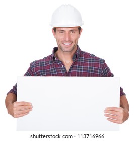 Man Wearing Hard Hat Holding Placard On White Background