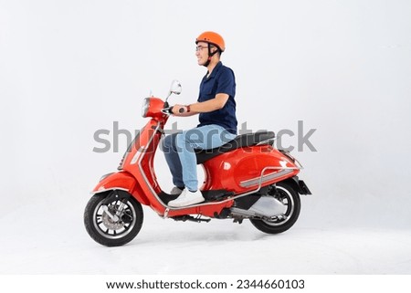 a man wearing a helmet and riding a motorbike ストックフォト © 