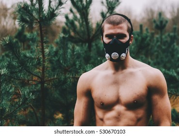 Man Wearing High Altitude Mask Fitness Training. 
