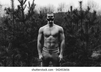 Man Wearing High Altitude Mask Fitness Training. Black And White Photo
