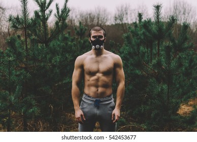 Man Wearing High Altitude Mask Fitness Training. Black And White Photo
