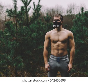 Man Wearing High Altitude Mask Fitness Training. 